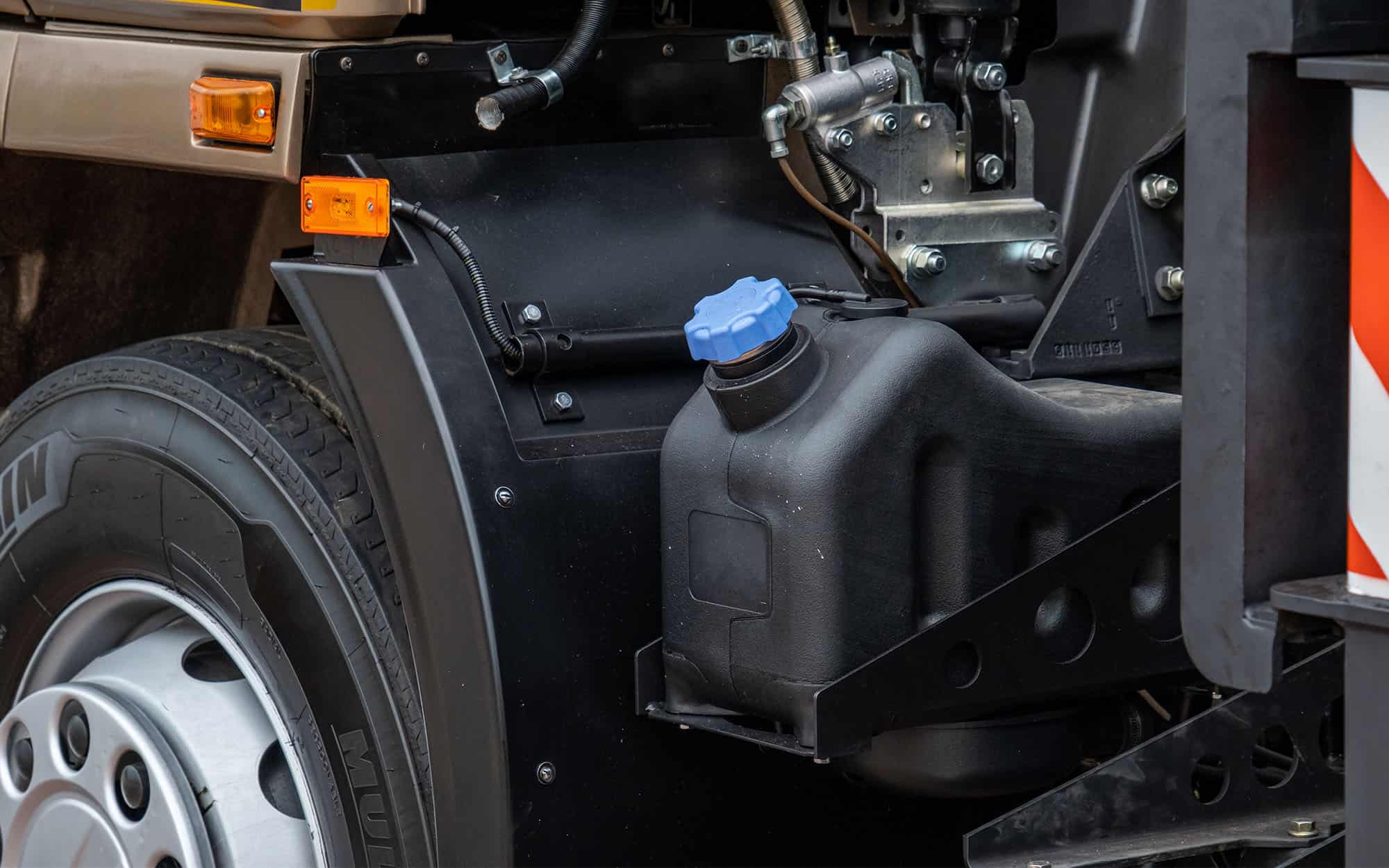 Side view of truck and agricultural vehicle fuel system