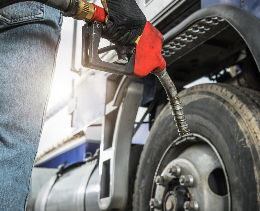 Semi Truck Driver About to Refuel His Tractor Truck with Diesel Fuel