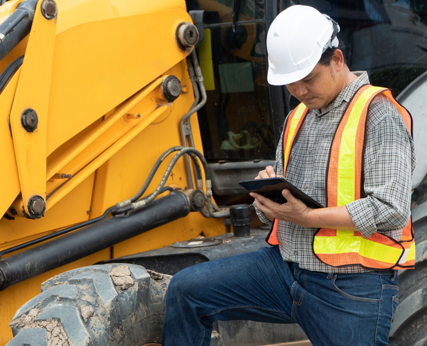 Worker using tablet for Fuel Inventory Management with Fleet Management Systems