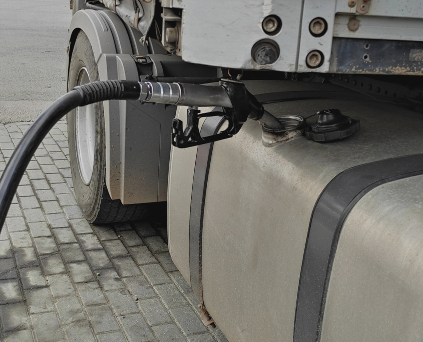 Fueling up a freight transport truck, side view